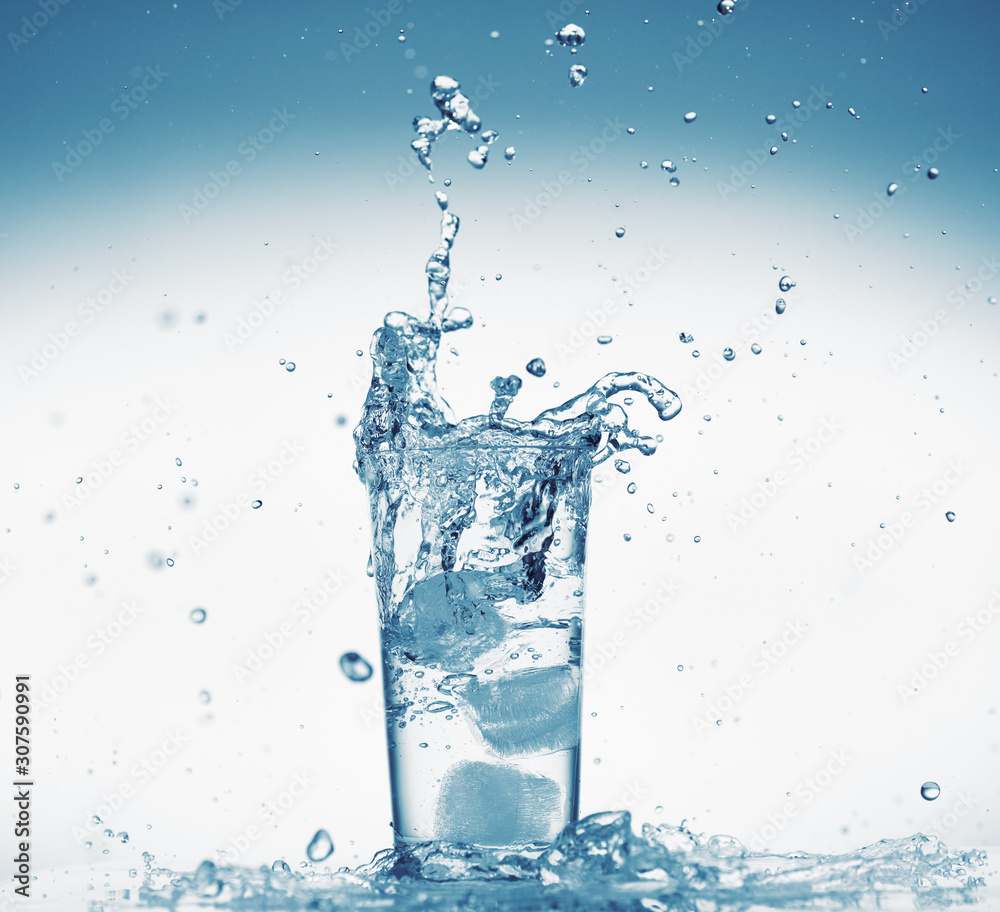 one glass of water with splash from falling ice cube, white background, isolated object