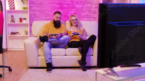 Revealing footage of beautiful young couple playing together video games