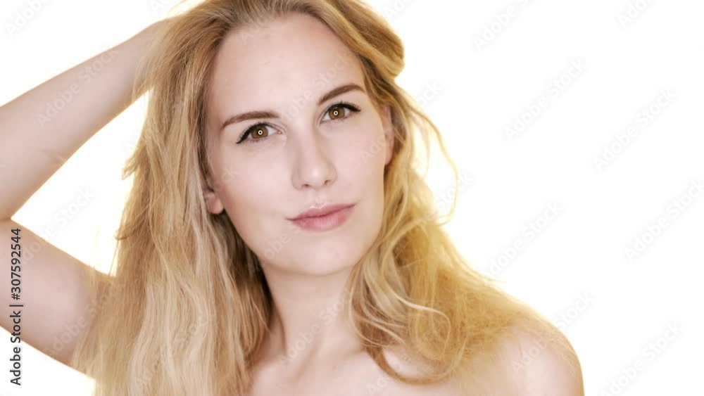 The Fierce Look Of A Beautiful Strong Woman Holding Her Long Blonde Hair - Close Up Shot The Fierce Look Of A Beautiful Strong Woman Holding Her Long Blonde Hair - Close Up Shot