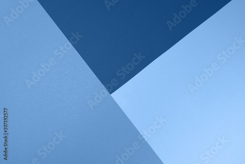 Background in trendy blue colors. Fashionable paper. Top view. Minimal concept. Trendy monochrome color
