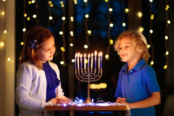 Kids celebrating Hanukkah. Festival of lights.