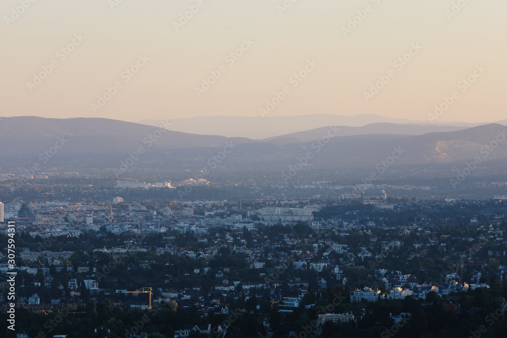 Beautiful sunset with the view of the skyline over the hills around Vienna, Austria