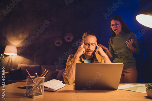 Portrait of his he her she nice attractive spouses mad girl tired guy working self developing having crisis scolding fight at night dark home house living-room apartment