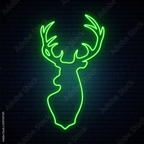 Deer green neon sign. Bright light reindeer silhouette on brick wall. New Year vector banner.