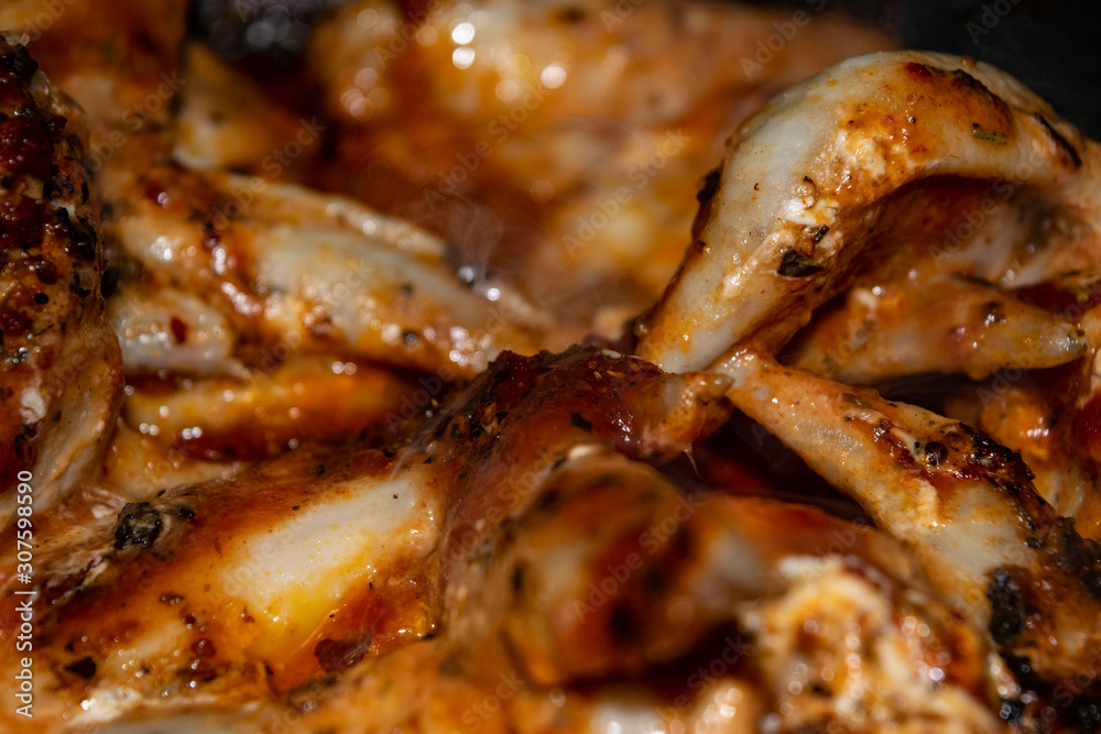 Chicken wings marinated with spices fried in a pan. Home cooking Chicken wings marinated with spices fried in a pan. Home cooking