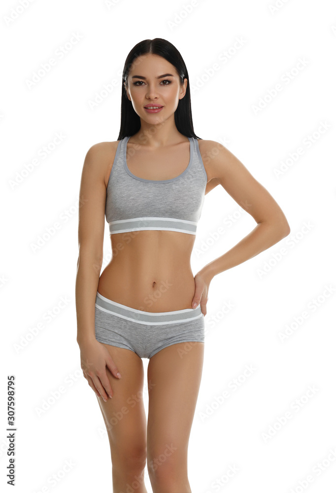 Beautiful young woman in grey sportive underwear isolated on white Beautiful young woman in grey sportive underwear isolated on white