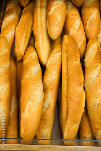 fresh baked baguettes in bakery. Assortment of baked bread