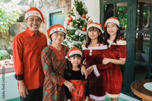 asian happy family celebrating christmas together at home