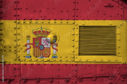 Spain flag depicted on side part of military armored tank closeup. Army forces conceptual background photo