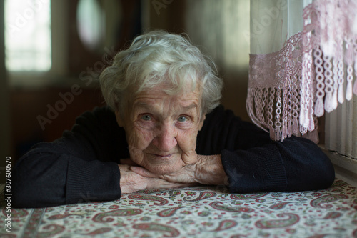 Portrait of the lone gray-haired elderly woman.