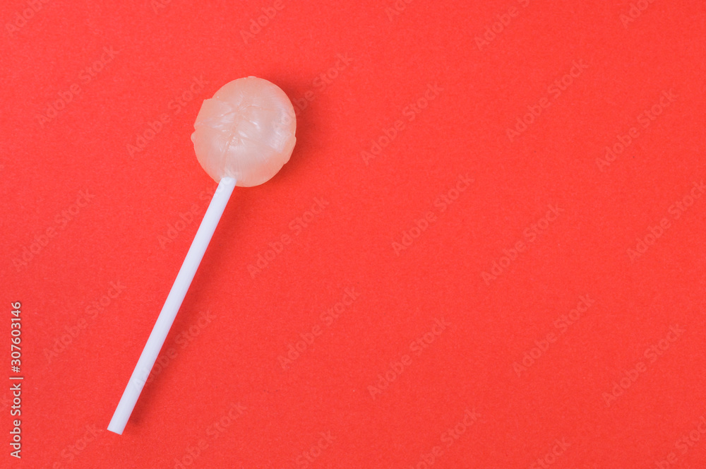 Lollipop on red background, mock up, copy space, text space Lollipop on red background, mock up, copy space, text space