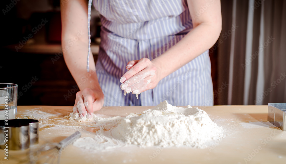 chef kneads baking dough, dirty chef hands in pastry, cooking, bakery concept