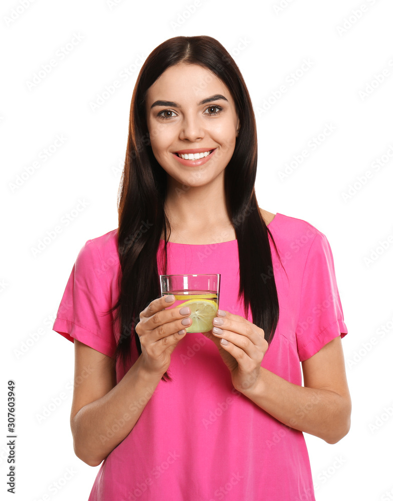 Beautiful young woman with tasty lemon water on white background Beautiful young woman with tasty lemon water on white background