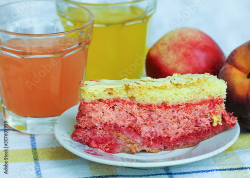 Homemade fresh cake with raspberry fillet, fruit and juices