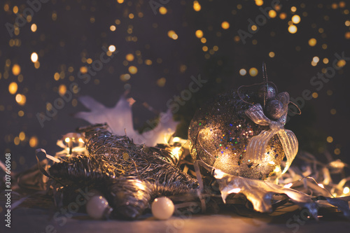 Glitter Christmas and New Year background with Christmas Ball and light. photo