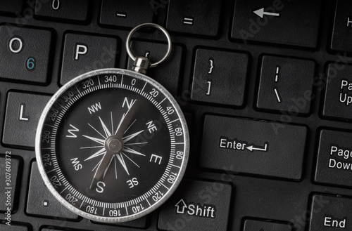 Εκτύπωση καμβά Black and White Compass on keyboard background for direction, assistance, guidan