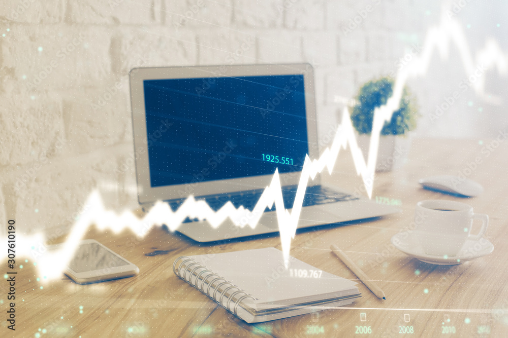 Naklejka premium Forex Chart hologram on table with computer background. Double exposure. Concept of financial markets.