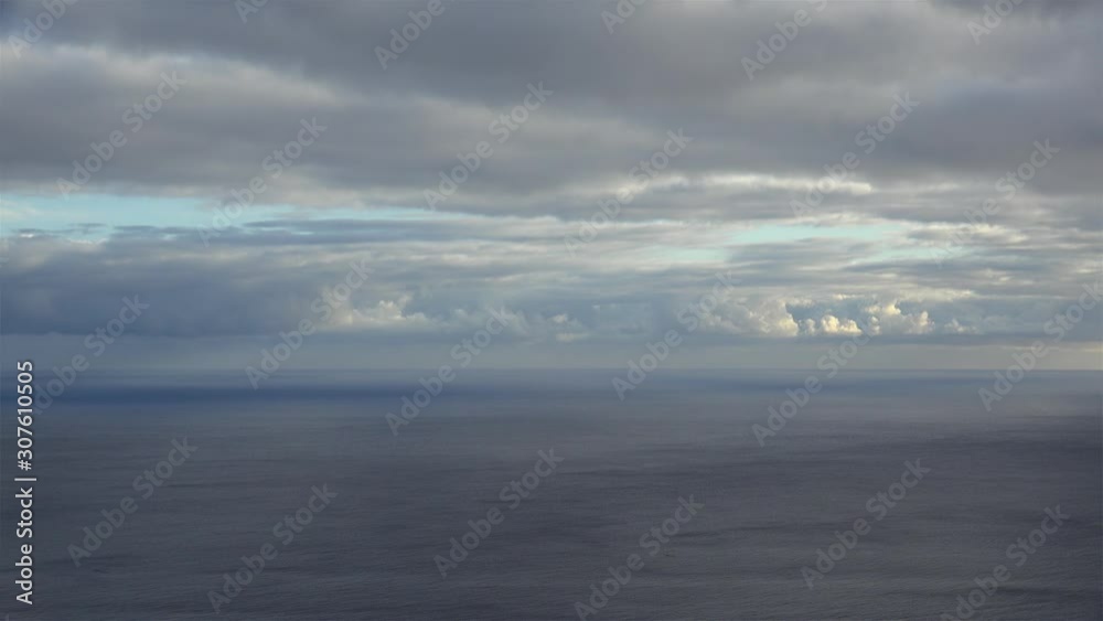Long shot of the calm Atlantic under clouds. Long shot of the calm Atlantic under clouds.