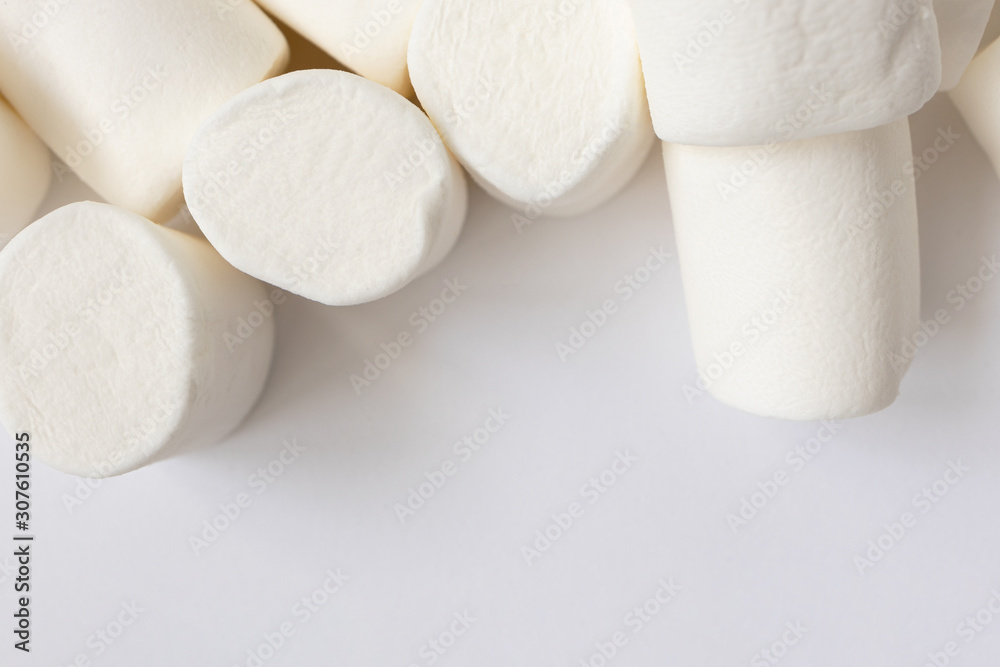Border from white marshmallows texture, close-up. Heap of sweet food with copy space, top view. Christmas candy background Border from white marshmallows texture, close-up. Heap of sweet food with copy space, top view. Christmas candy background