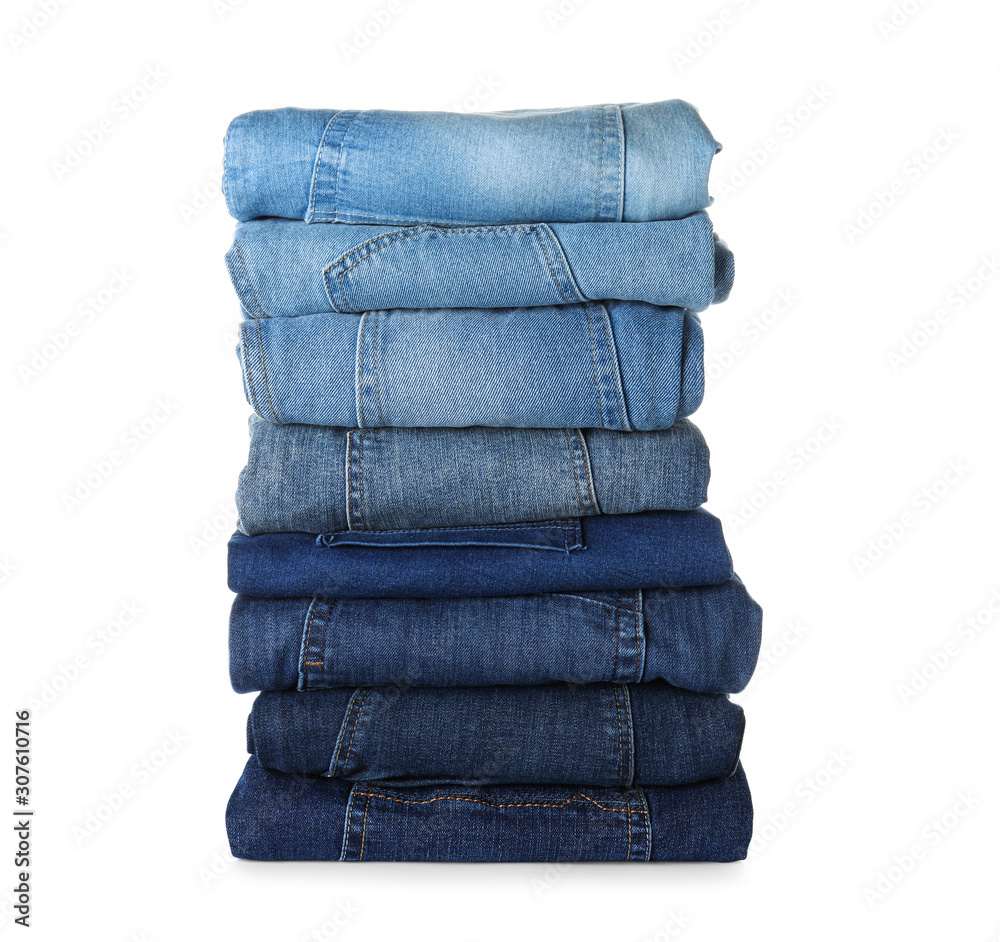 Stack of different jeans isolated on white