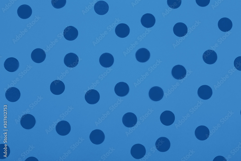 Coral confetti on contrast background  in trendy blue toning. Main color trend for 2020 year.