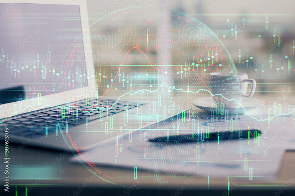 Forex graph hologram on table with computer background. Double exposure. Concept of financial markets. Forex graph hologram on table with computer background. Double exposure. Concept of financial markets.