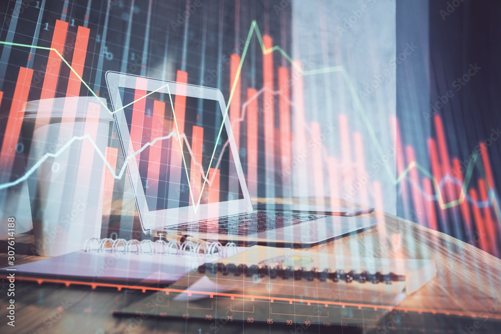 Forex Chart hologram on table with computer background. Multi exposure. Concept of financial markets. Forex Chart hologram on table with computer background. Multi exposure. Concept of financial markets.