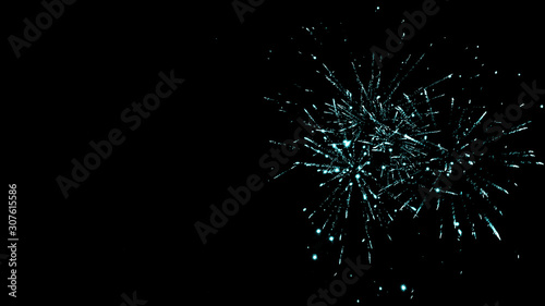Green festive traditional fireworks in night sky, isolated on black