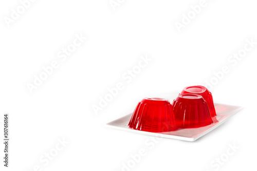 Strawberry jellies on a plate isolated on white background. Copy space