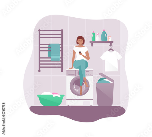 Beautiful girl sitting on a washing machine and looking at the phone. Housewife doing laundry. Vector illustration in modern flat style. photo