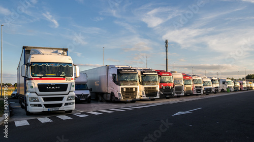 Fotografie Row of trucks on a truck parking along the E17 highway in Belgium on June 23, 20