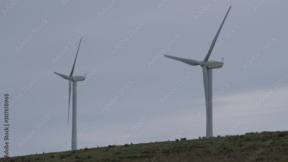 Two Powerful Wind Turbines Generating Renewable eco Friendly Energy on agricultural land in Lancashire UK Two Powerful Wind Turbines Generating Renewable eco Friendly Energy on agricultural land in Lancashire UK