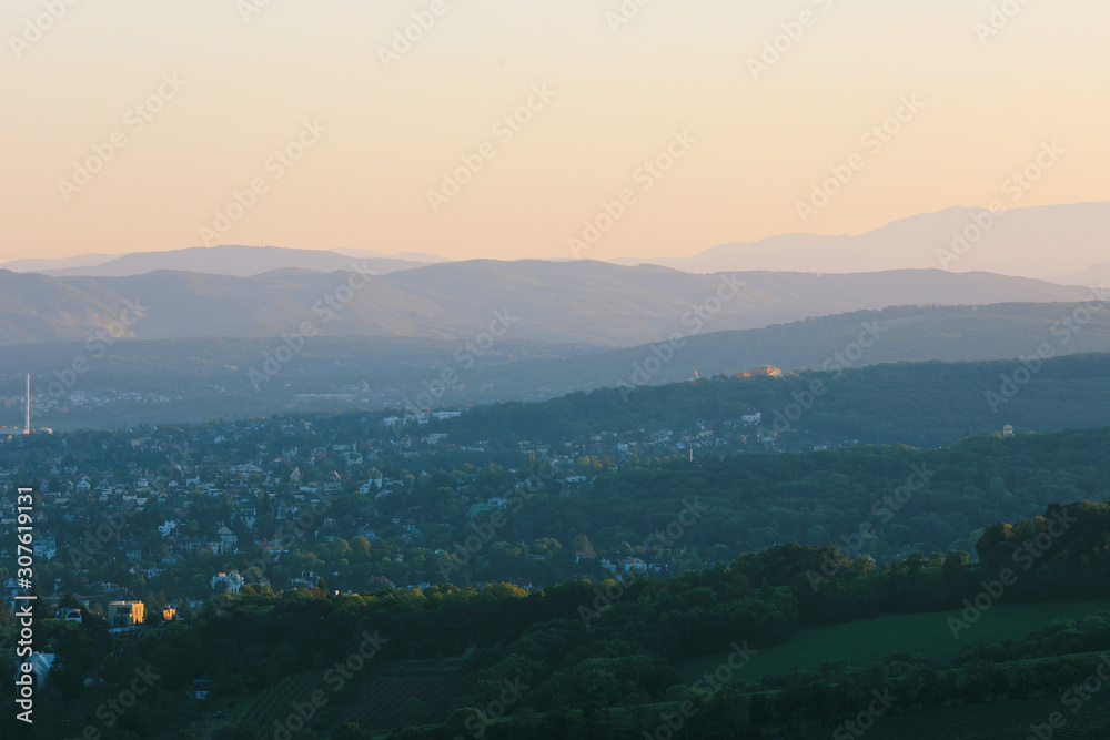 Beautiful sunset with the view of the skyline over the hills around Vienna