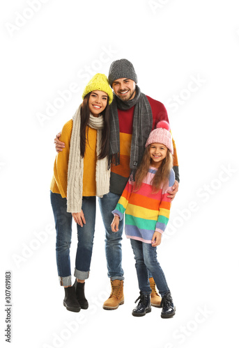 Happy family in warm clothes on white background. Winter vacation