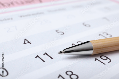 Wallpaper Mural Pen on calendar page, closeup. Planning concept Torontodigital.ca