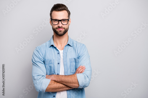 Photo of positive business guy young boss chief hands crossed self-confident person friendly smiling colleagues partners wear specs casual denim outfit isolated grey color background