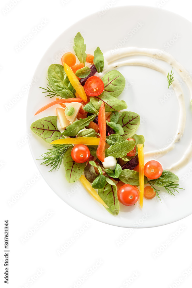 micro-greens and vegetables salad on a white plate micro-greens and vegetables salad on a white plate