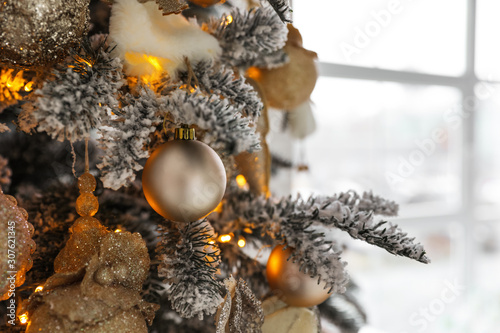 Beautiful Christmas tree Indoors, closeup. Festive interior decoration