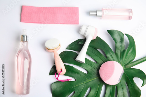 Photography Composition with face cleansing brushes on white background, top view