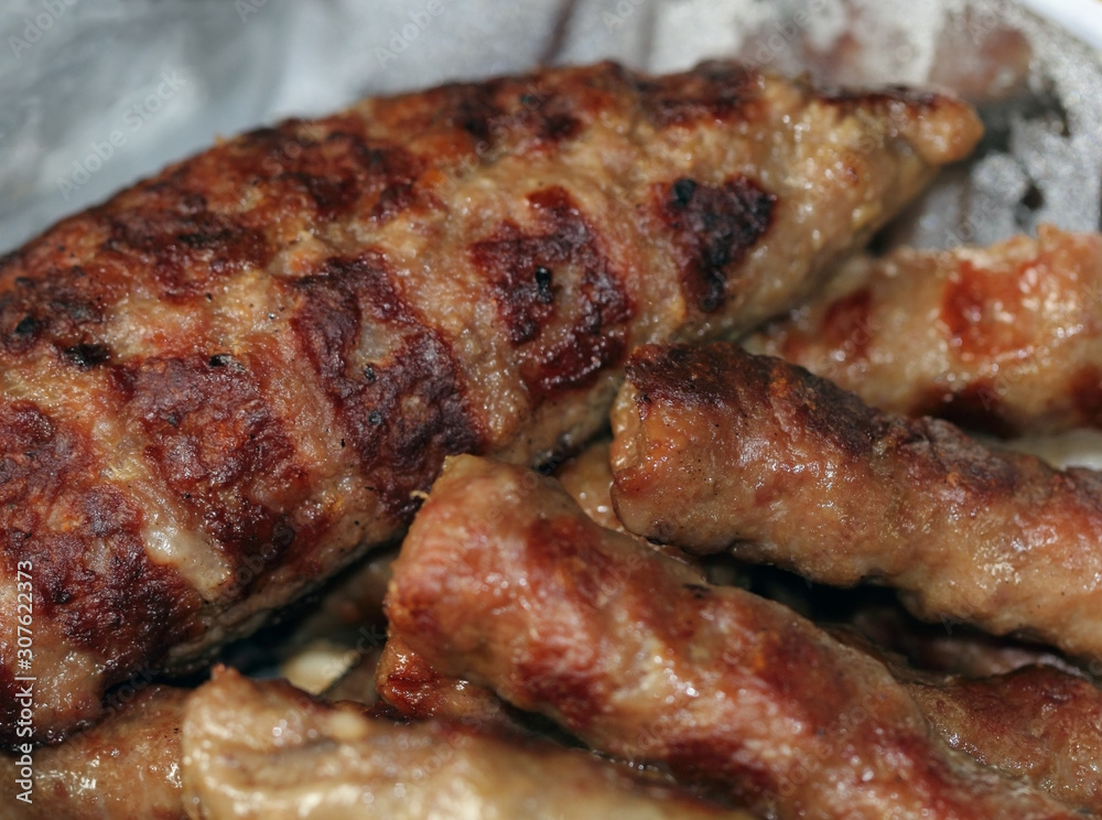 The close up of grilled Stuffed hamburger with kebabs.