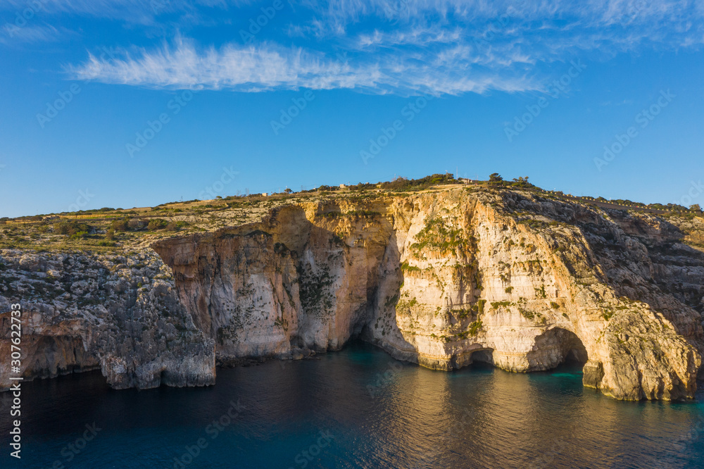 Aerial view of Blue grotto, caves and cliffs.  Mediterranean sea, blue sky, winter. Malta island 
