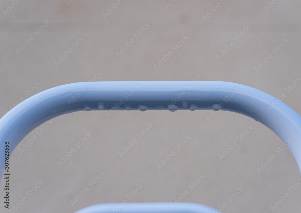 Close up of the stair railing of a surface pool