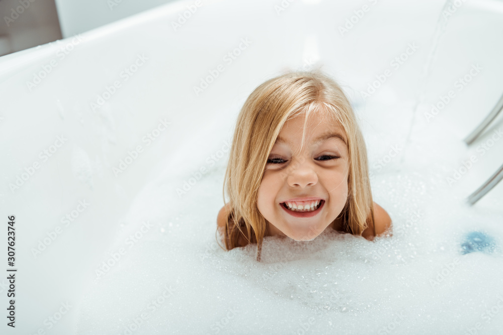 Download happy naked child taking bath with bath foam Stock Photo and explo...
