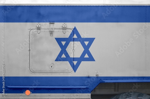 Israel flag depicted on side part of military armored truck closeup. Army forces conceptual background photo