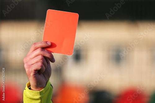 Valokuva Football referee shows a red card.