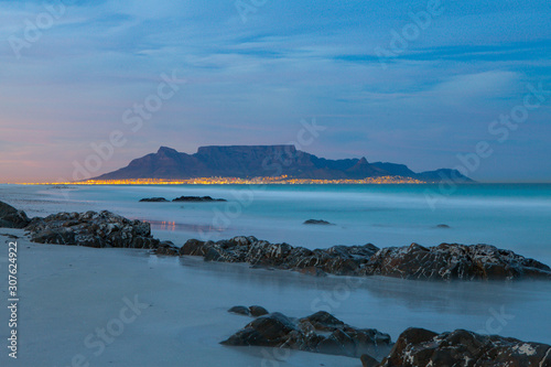 scenic view of table mountain cape town south africa from blouberg with city lights at night