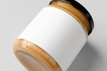 Peanut, almond, nut butter jar mockup with blank label. Closeup.