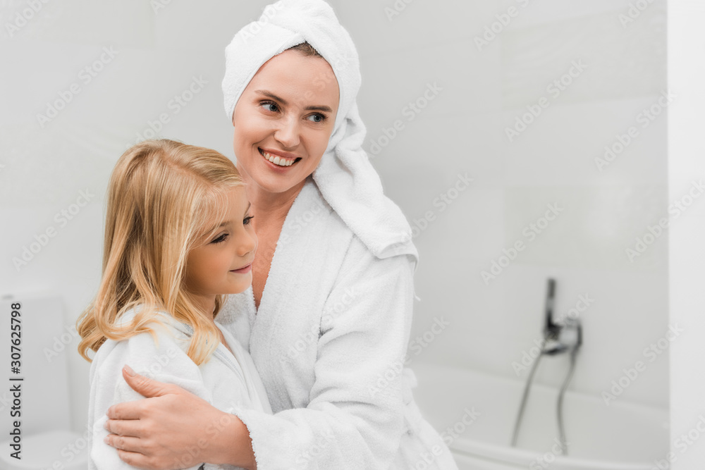 happy mother touching cute daughter in bathroom happy mother touching cute daughter in bathroom