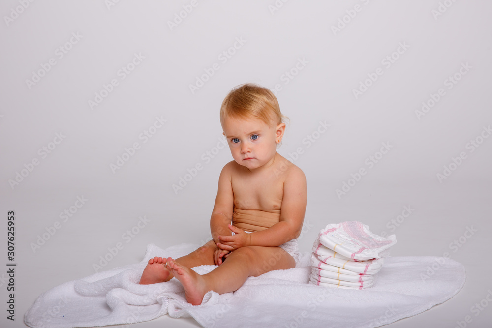 Infant baby toddler in diaper sitting crawling back happy smile on white background Infant baby toddler in diaper sitting crawling back happy smile on white background