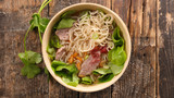 bowl of noodles soup with beef and coriander